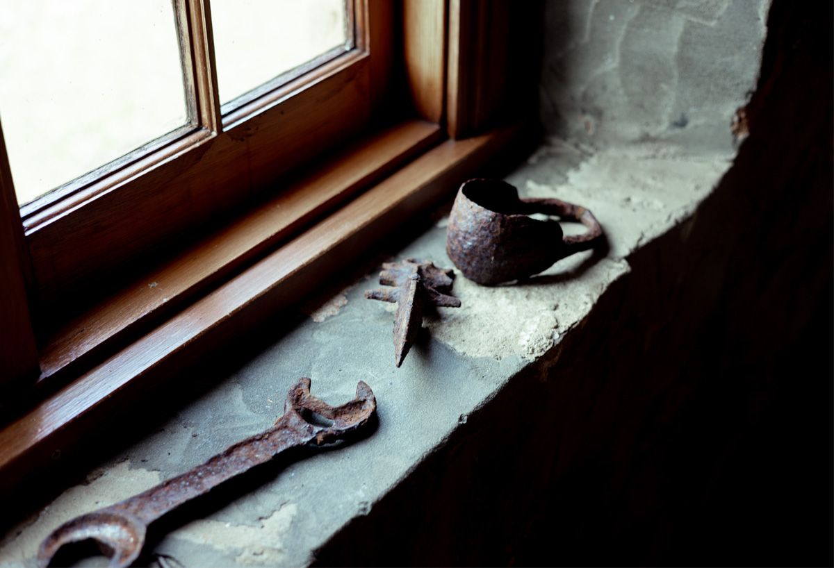 Blacksmith's Cottage old blacksmiths tools by the window